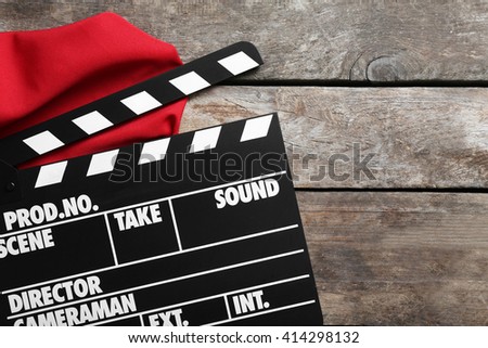 Movie clapper on wooden background