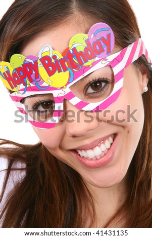 A pretty, and young birthday girl with colorful accessories