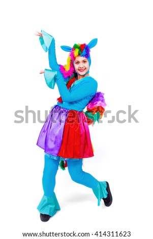 Beautiful girl posing  in fancy dress horse or pony, isolated on a white background