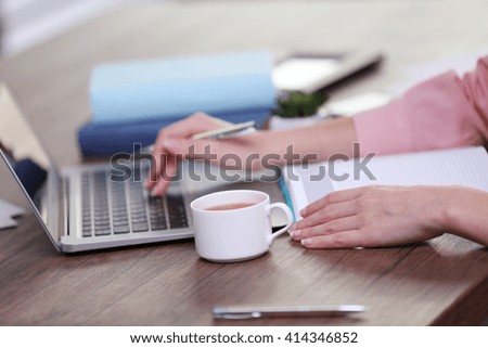 Businesswoman typing on keyboard in office