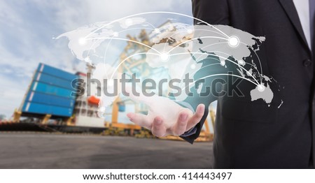 Global network coverage world map on hand of businessman ,Industrial Container Cargo freight ship at habor for Logistic Import Export background (Elements of this image furnished by NASA) Royalty-Free Stock Photo #414443497