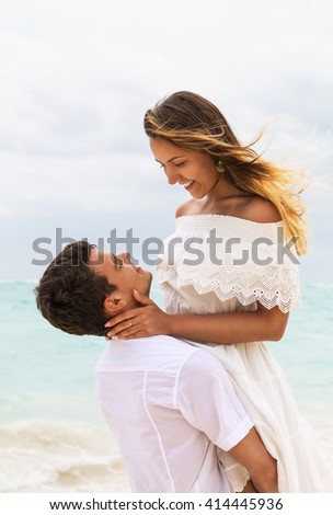 The picture of happy couple in love on the beach