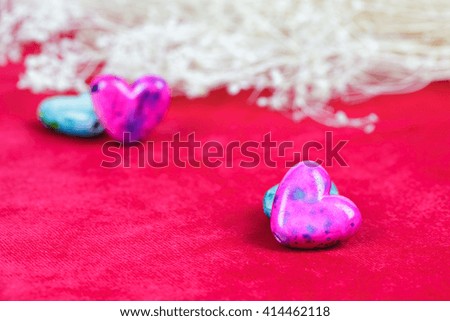 Love hearts with flower on red background.selective focus pink heart
