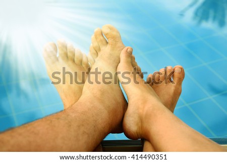 legs in love couple in the swimming pool