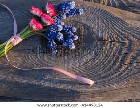 pink and blue bouquet on wooden background