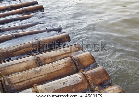 bamboo rafts floating in a lake, water