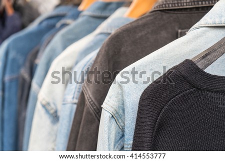Clothes hang on a shelf