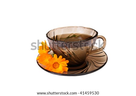 One cup of herbal tea and calendula blossoms isolated on a white background.
