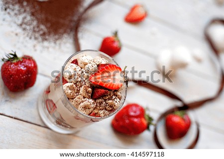 beautiful presentation of cottage cheese - coffee dessert with strawberries