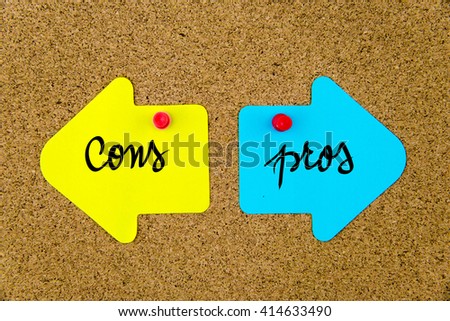 Message CONS versus PROS on yellow and blue paper notes as opposite arrows pinned on cork board with thumbtacks. Choice conceptual image
