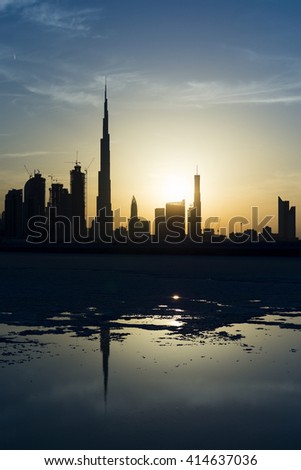 This is one in a series of photographs of Dubai at sunset from the Design District. This part of Dubai Creek has been dammed and most of the water has evaporated over time, leaving the salt deposits.