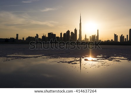 This is one in a series of photographs of Dubai at sunset from the Design District. This part of Dubai Creek has been dammed and most of the water has evaporated over time, leaving the salt deposits.