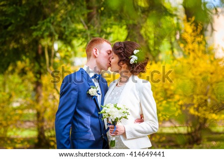 wedding, just married couple kiss in a forest