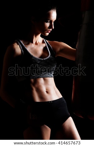 portrait of a woman boxer, aggressive and ready to fight