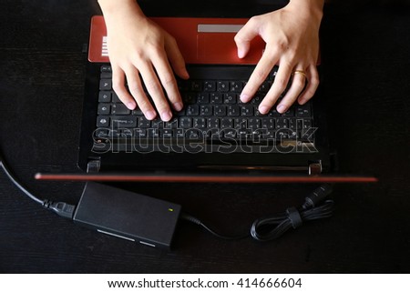 Hands multitasking man working on laptop connecting wifi internet, businessman hand busy using laptop at office desk, finger typing on keyboard computer sitting at wooden table,hardworking life