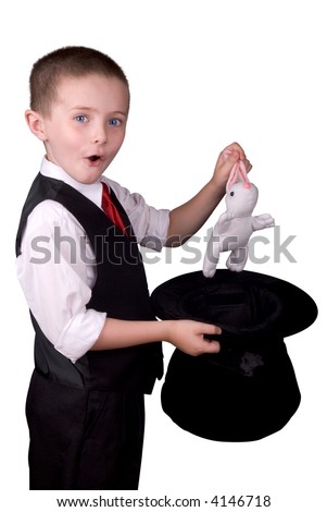 child dressed as a magician pulling a rabbit from his hat isolated over a white background Royalty-Free Stock Photo #4146718