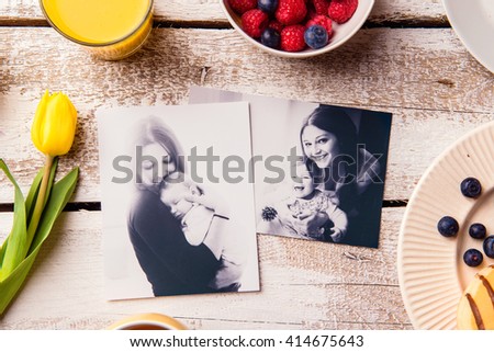 Mothers day composition. Black-and-white pictures and breakfast