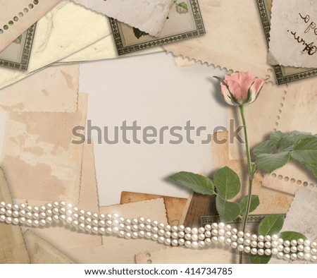Old vintage archive with photos, letters, pearls and pink roses