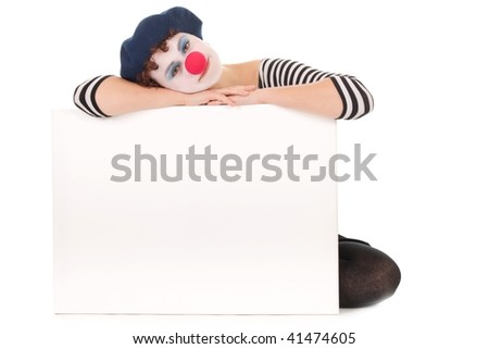 Young woman wearing clown face holding billboard isolated on white