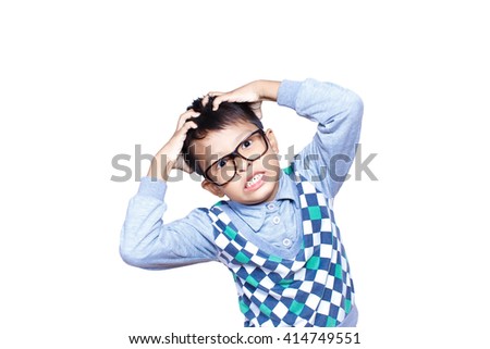 Little Asian boy scratching his scalp over white