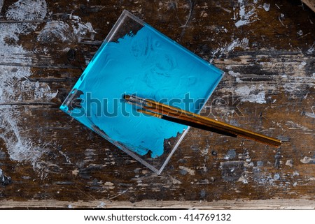 Set of brushes on the blue palette