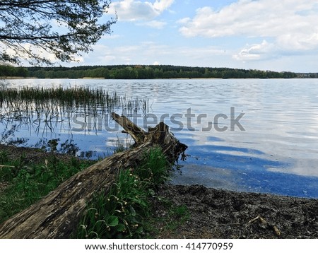 Lake landscape with clouds and blue sky