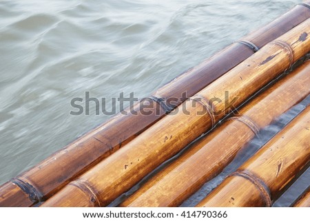 bamboo rafts floating in a lake, water