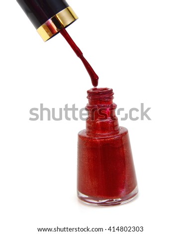 red nail polish bottle with splash isolated on white