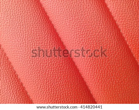 Texture colored leatherette red, for design and upholstery for decoration and fashion, for the background and Texture