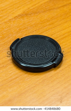 Lens Cap on The Wood