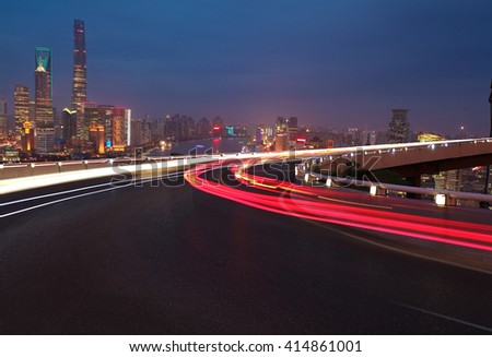 Empty road textured floor with Aerial photography bird-eye view at Shanghai bund Skyline of night scene 
