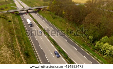 The highway between woods viewed from the air - Aerial view
