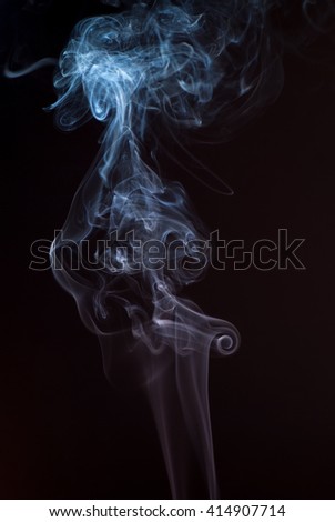 Beautiful smoke on the black background - macro photo