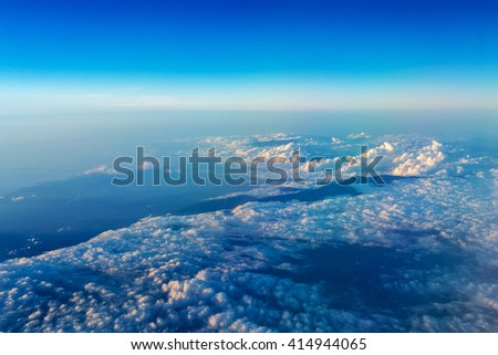Big white cloud and blue sky background,view from airplane, earth view, blue and white clouds