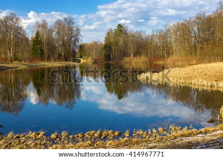 Beautiful spring landscape with reflection on the sunny day