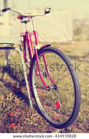 Vintage Bicycle /summer background with bicycle (toned picture)