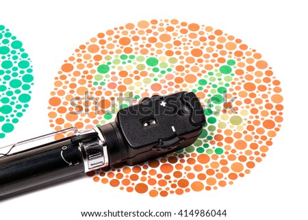 Ophthalmoscope is on a Ishihara color vision test chart Royalty-Free Stock Photo #414986044