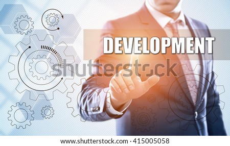 business, technology, programming, internet and virtual reality concept. Businessman pressing development button on virtual screens with hexagons and transparent honeycomb