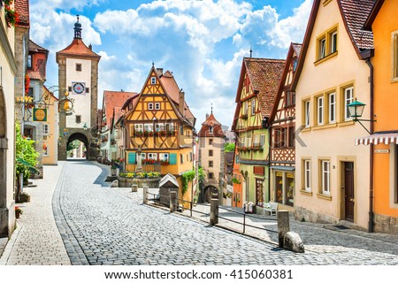 Beautiful postcard view of the famous historic town of Rothenburg ob der Tauber on a sunny day with blue sky and clouds in summer, Franconia, Bavaria, Germany Royalty-Free Stock Photo #415060381