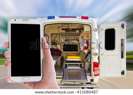 Man use mobile phone, image of ambulance as background.