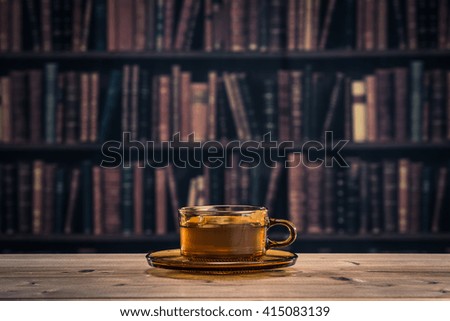 Cup and saucer that is placed on top of the desk