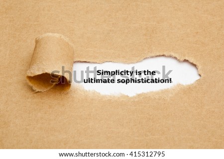 Motivational quote Simplicity is the Ultimate Sophistication, appearing behind torn brown paper. 