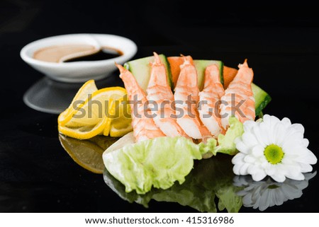 shrimp, sashimi sushi on a dark background