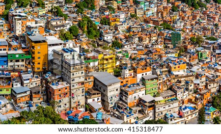 Aerial view of Rio's Rocinha favela, on a sunny afternoon. Royalty-Free Stock Photo #415318477