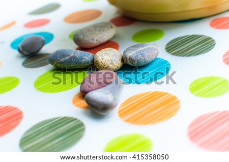 A group of smooth stones on the floor