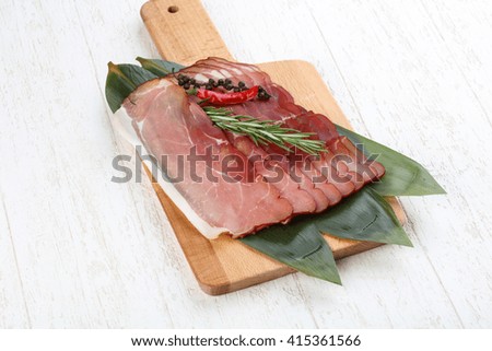 Famous Spain cuisine - pork Jamon with rosemary branch
