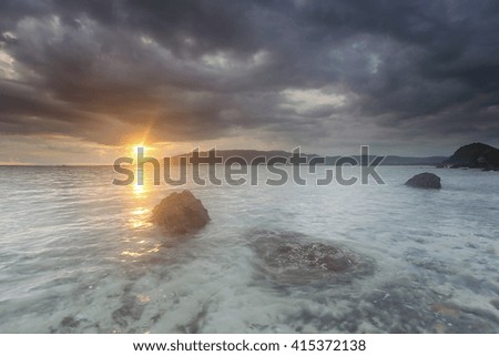 Stunning sunset with heavily clouds, nature background, grain and noise effect,soft focus and vibrant colour 