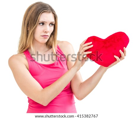 young lonely sad woman holding red valentine heart