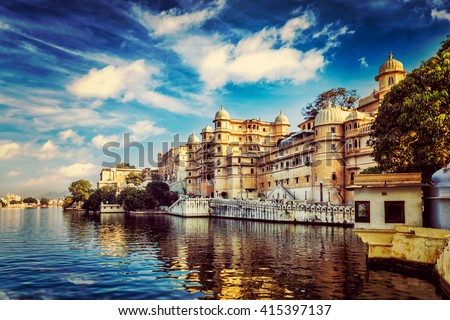 Romantic India luxury tourism wallpaper  - Vintage retro effect filtered hipster style image of Udaipur City Palace and Lake Pichola. Udaipur, Rajasthan, India