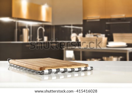 blurred brown kitchen interior space and worn old top place and white glasses table 